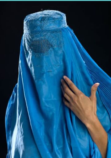 Afghan woman wearing her burqa - Juanmonino via Getty Image Signature